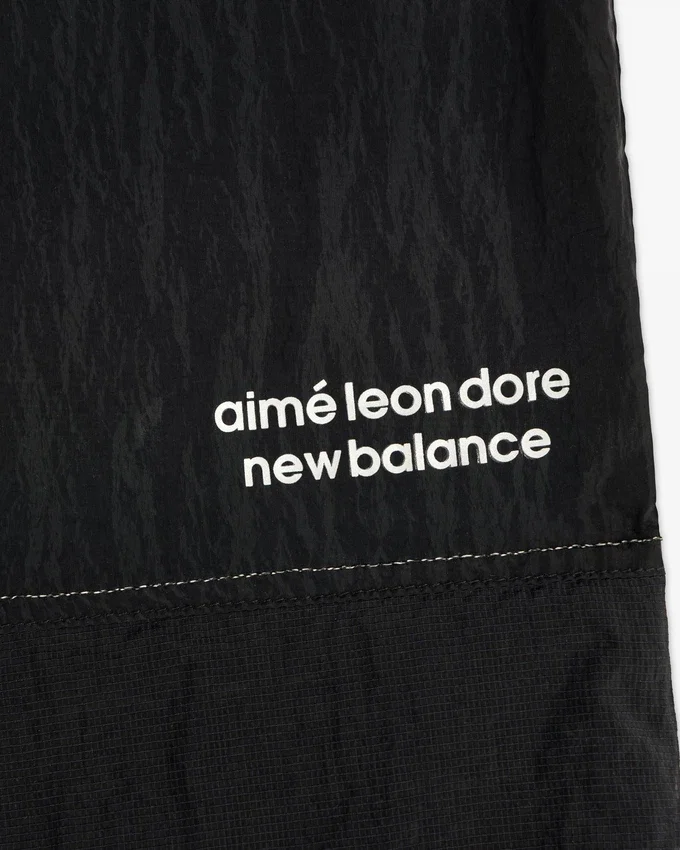ALD / New Balance Lätta uppvärmningsbyxor i nylon